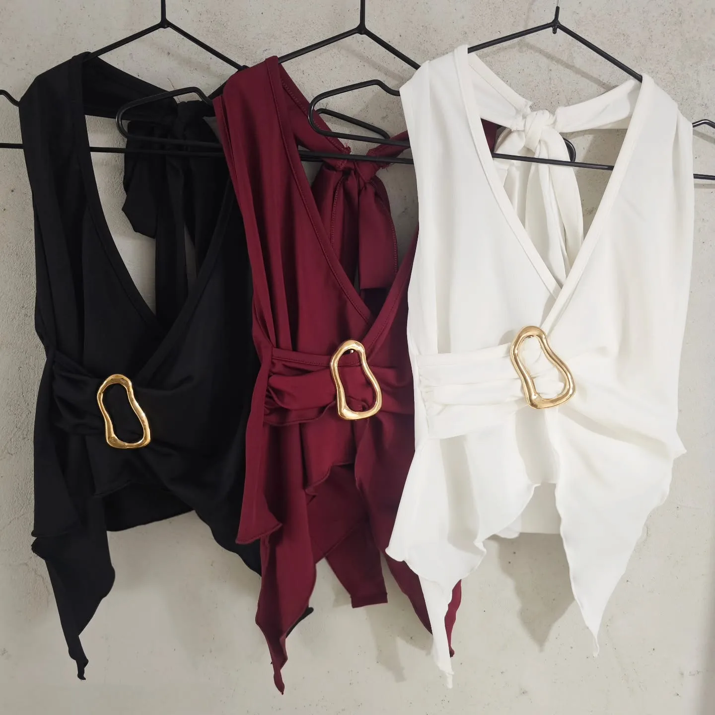 Wrap-Front Sleeveless top with a gold buckle view 2