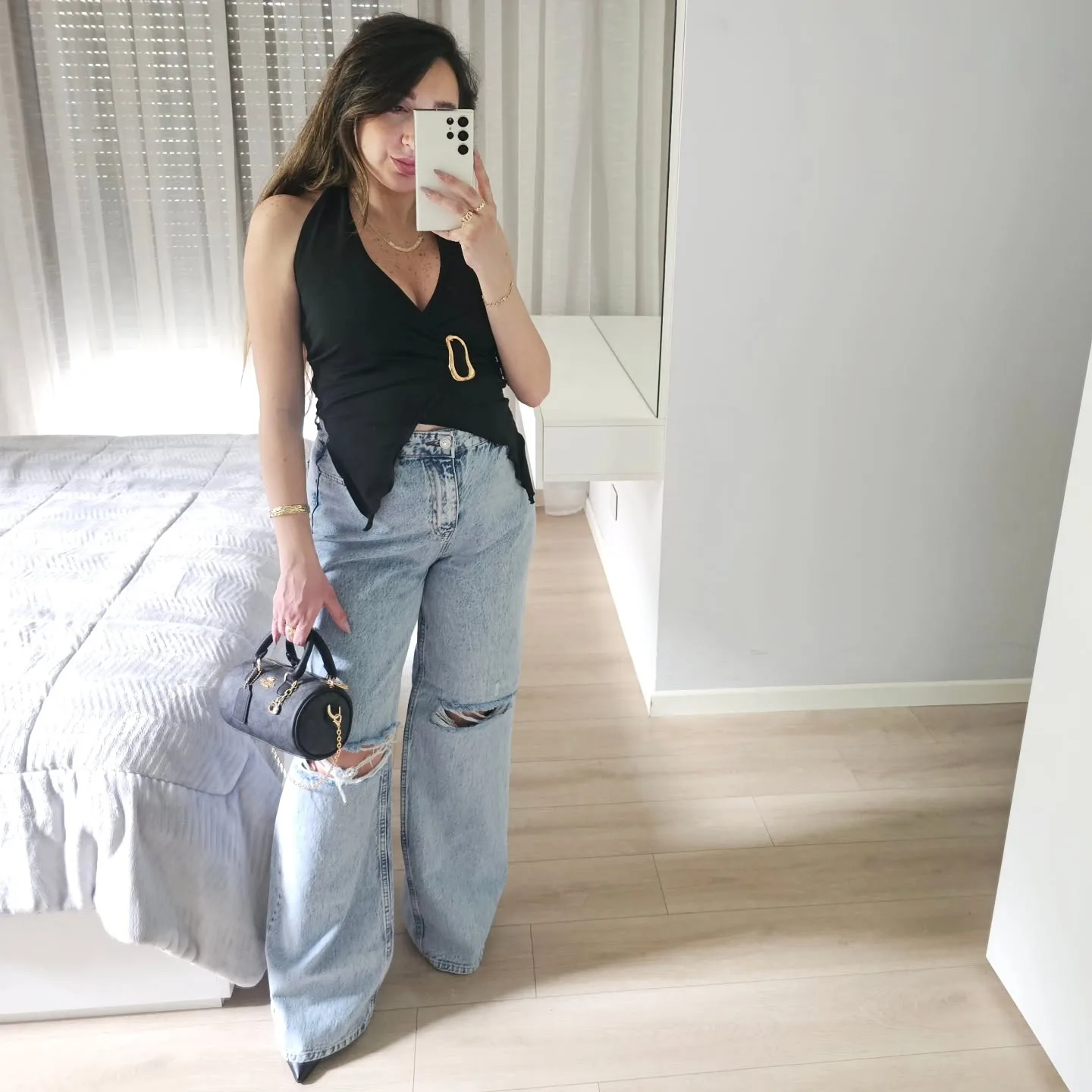 Wrap-Front Sleeveless top with a gold buckle view 1